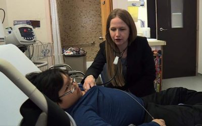 Dr. Tanya Holt, head of pediatric intensive care at the Royal University Hospital in Saskatoon, check on 12-year-old Quinton Kequahtooway as he recovers from a severe influenza virus infection.CTV News